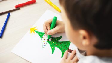 Christmas Drawing Child drawing Christmas tree on paper with felts