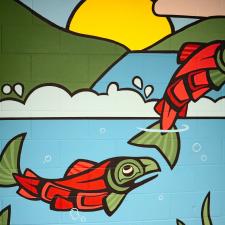 Indigenous Mural of salmon jumping out of the water
