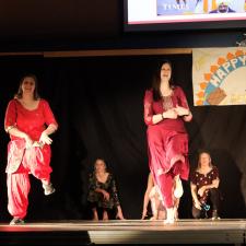 ATS Staff on stage performing a Bhangra dance