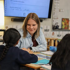 Teacher smiling at her student